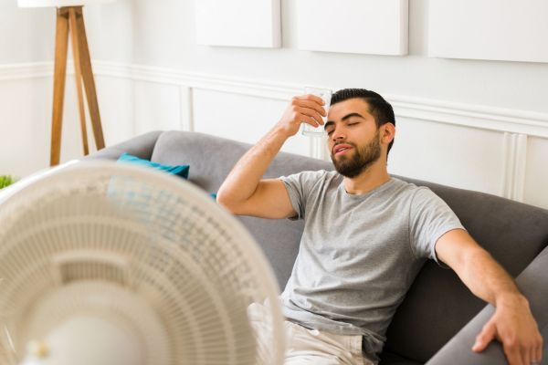 Man sweating because the air con is not working