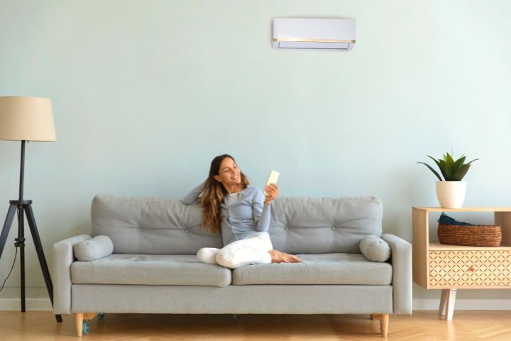 Woman Is Using Air Conditioner